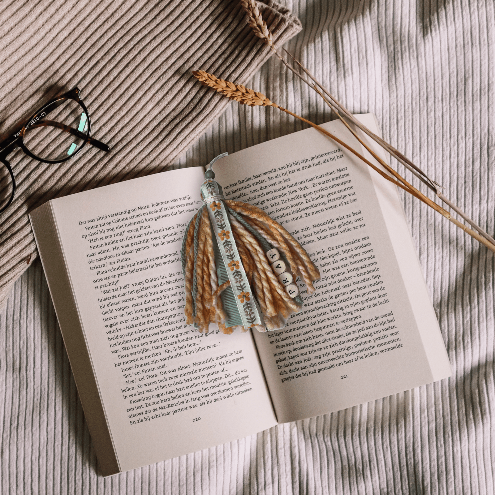 Pray Bookmark Tassel on book