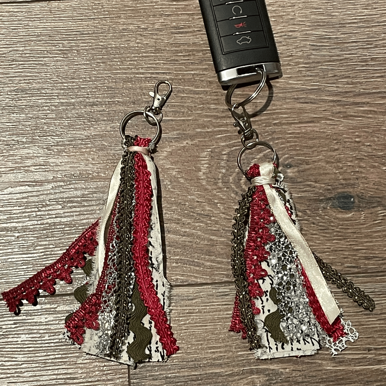 Two red tassel keychains