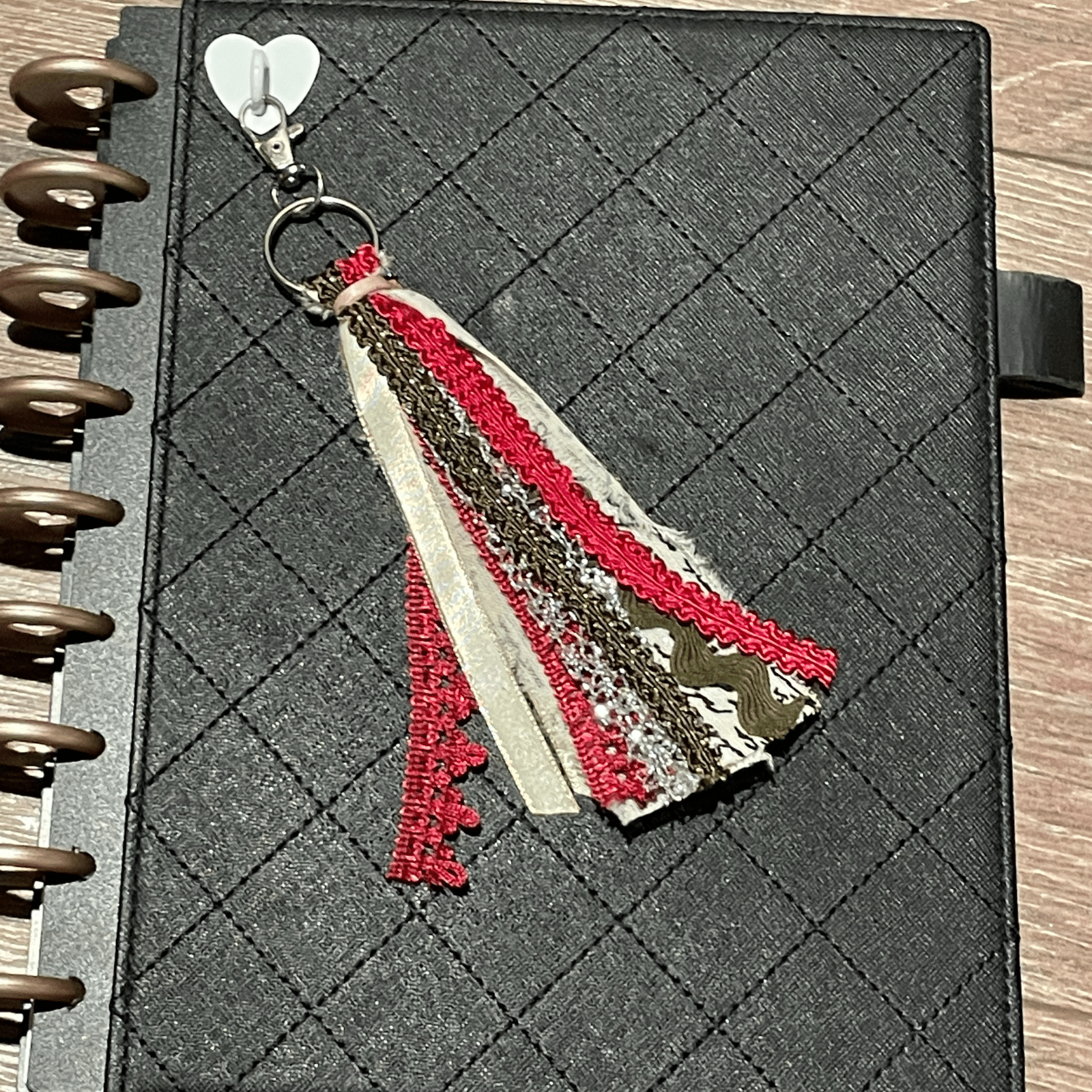 Red tassel keychain on journal