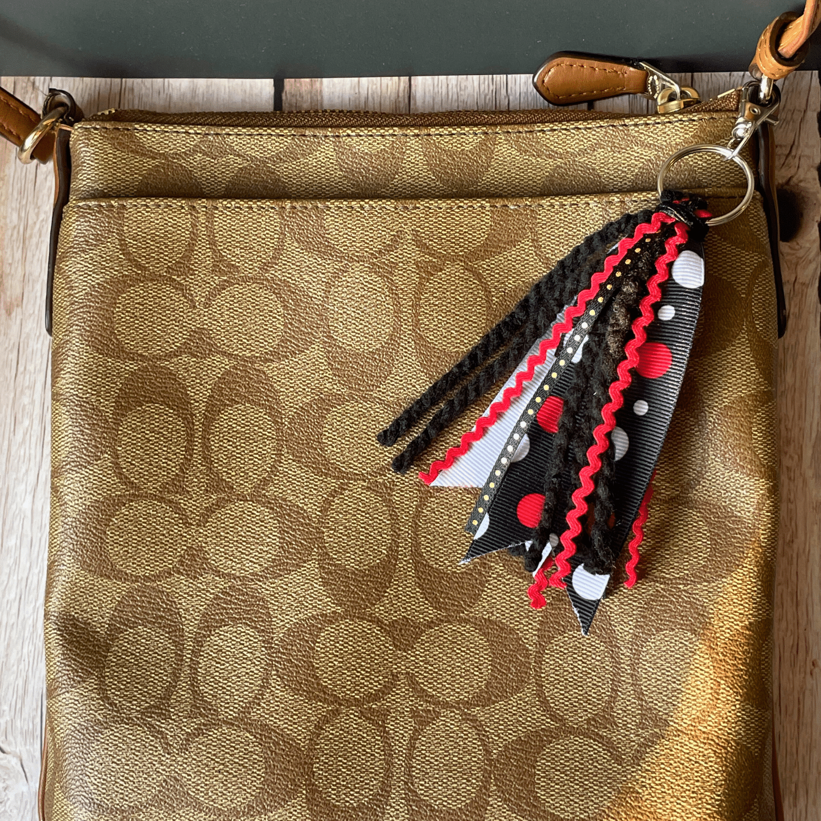 Black Red keychain on purse