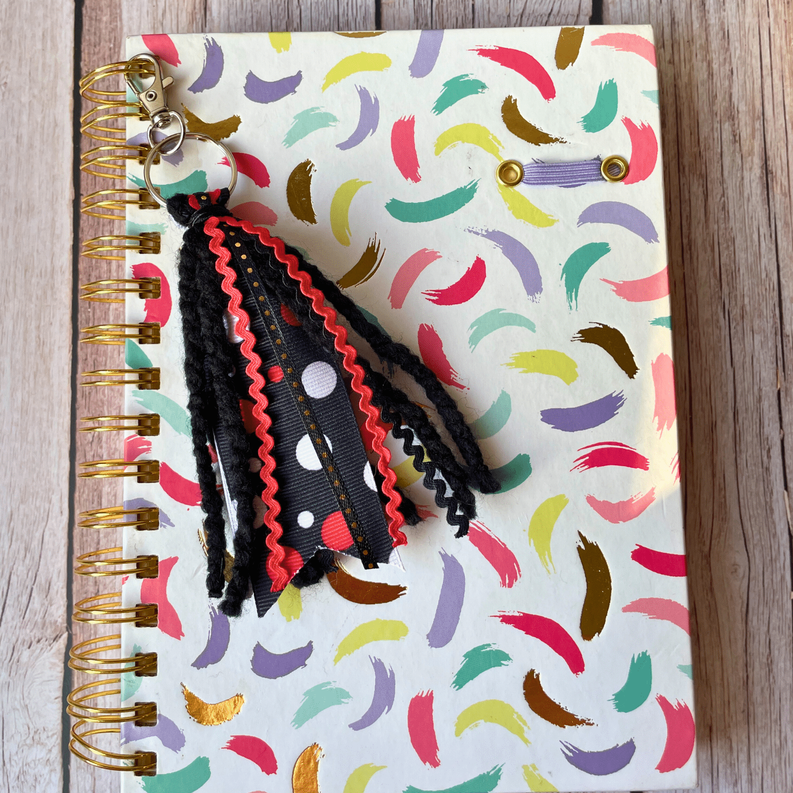 Black Red keychain on journal